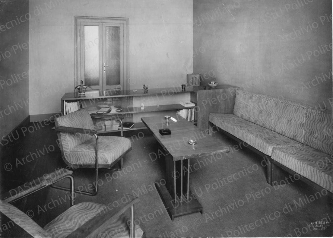Veduta di "Locale di soggiorno e di lavoro". Timbro a secco "Paoletti fotografo Milano". Positivo, bianco e nero, 201x281 mm, album giallo n.8, pag.49.