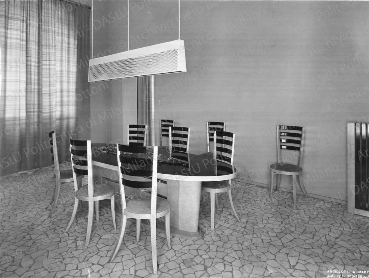 Veduta della sala da pranzo. Annotazione tipografica sul recto della fotografia: "Ancilotti & Martinotti S.A. tel 356-726 - Milano". Positivo, bianco e nero, 164x218 mm, album giallo n.8, pag.86.